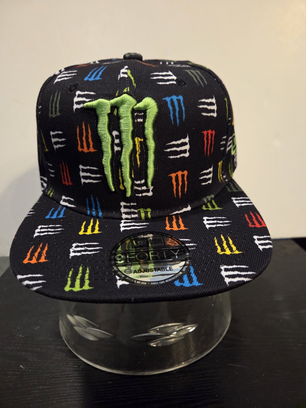 New Era Black Snapback Hat with Multicolor Monster Logo Pattern